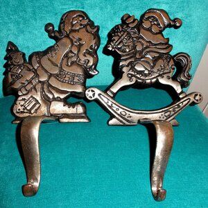vintage 2 Grandeur Noel cast iron Christmas stocking holders,santa,horse,gifts
